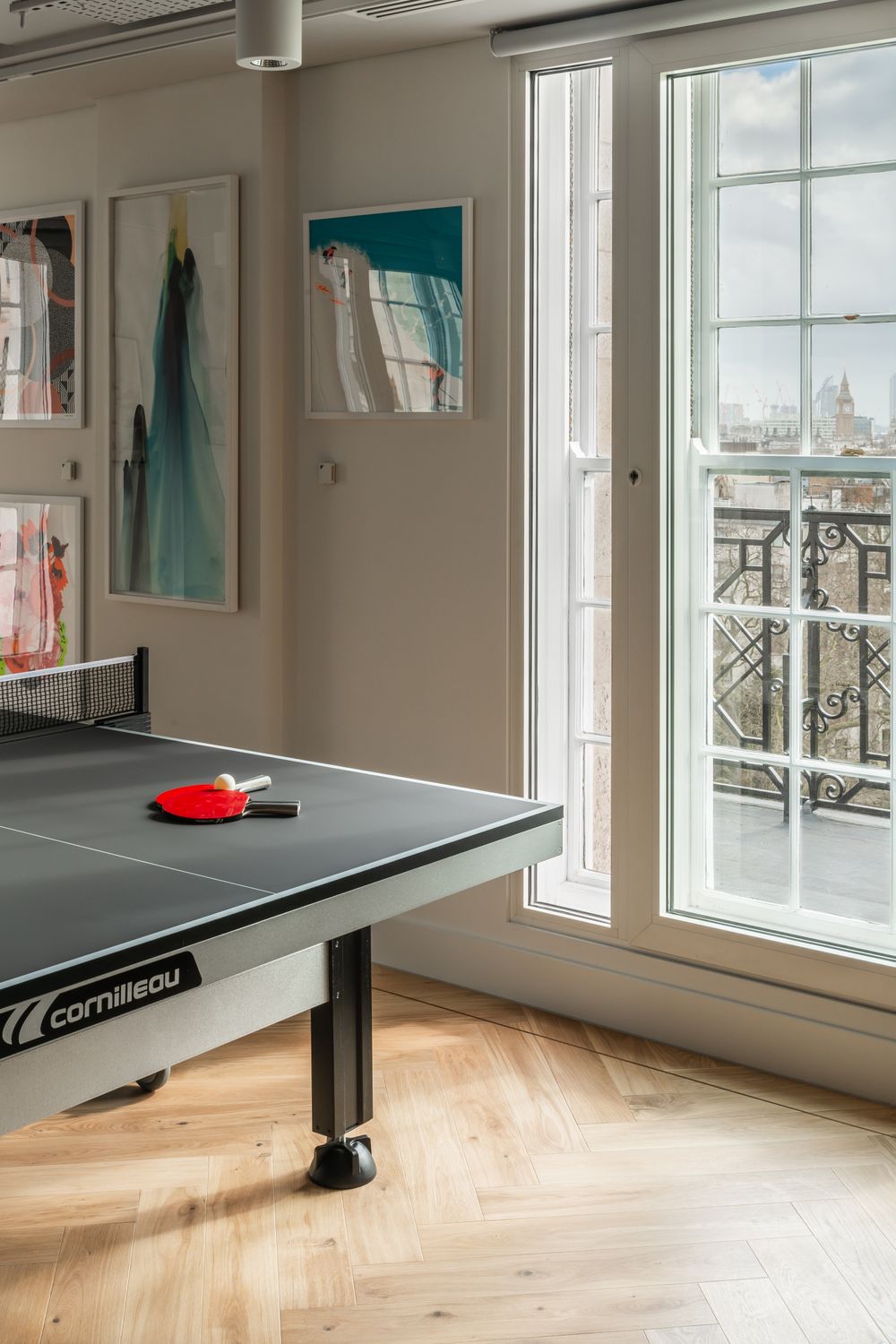 A ping-pong table and views over Green Park as seen from the café area.